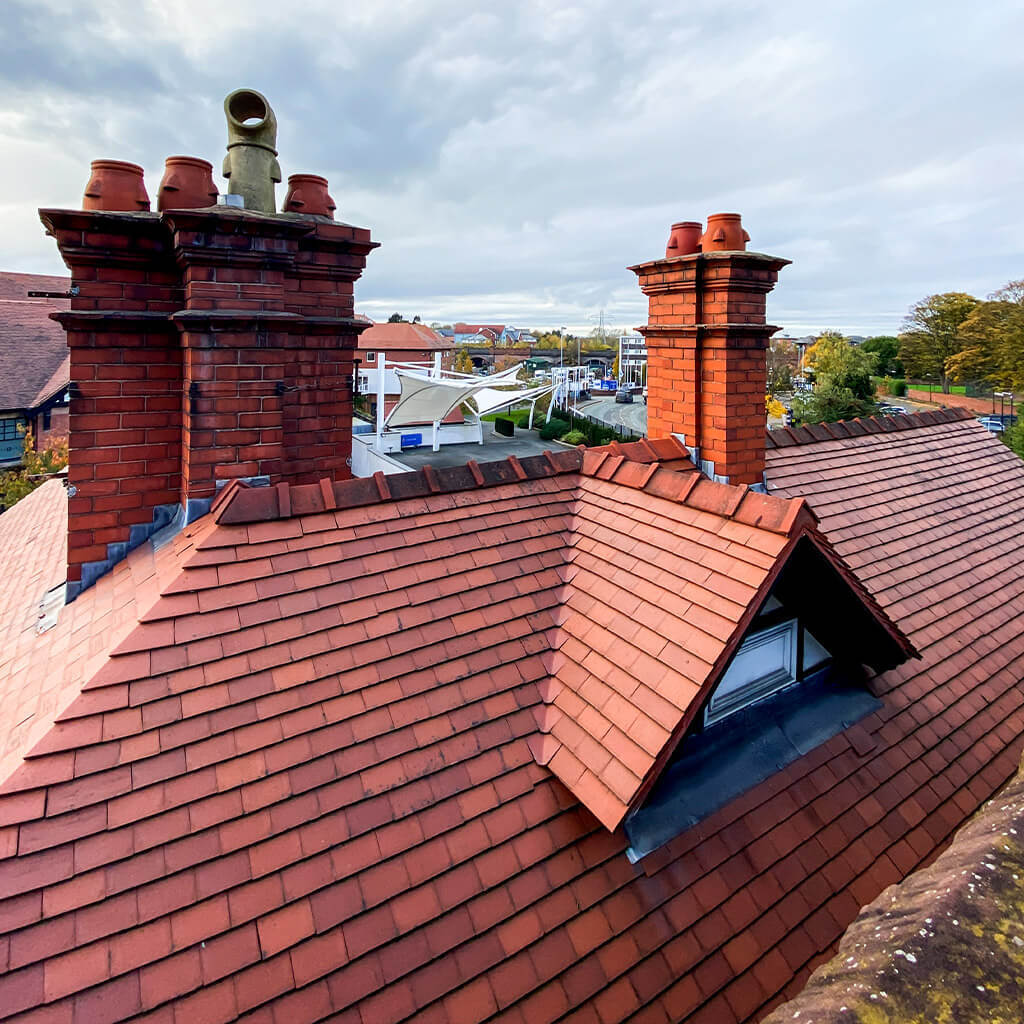 Tile roof repair around brick chimneys