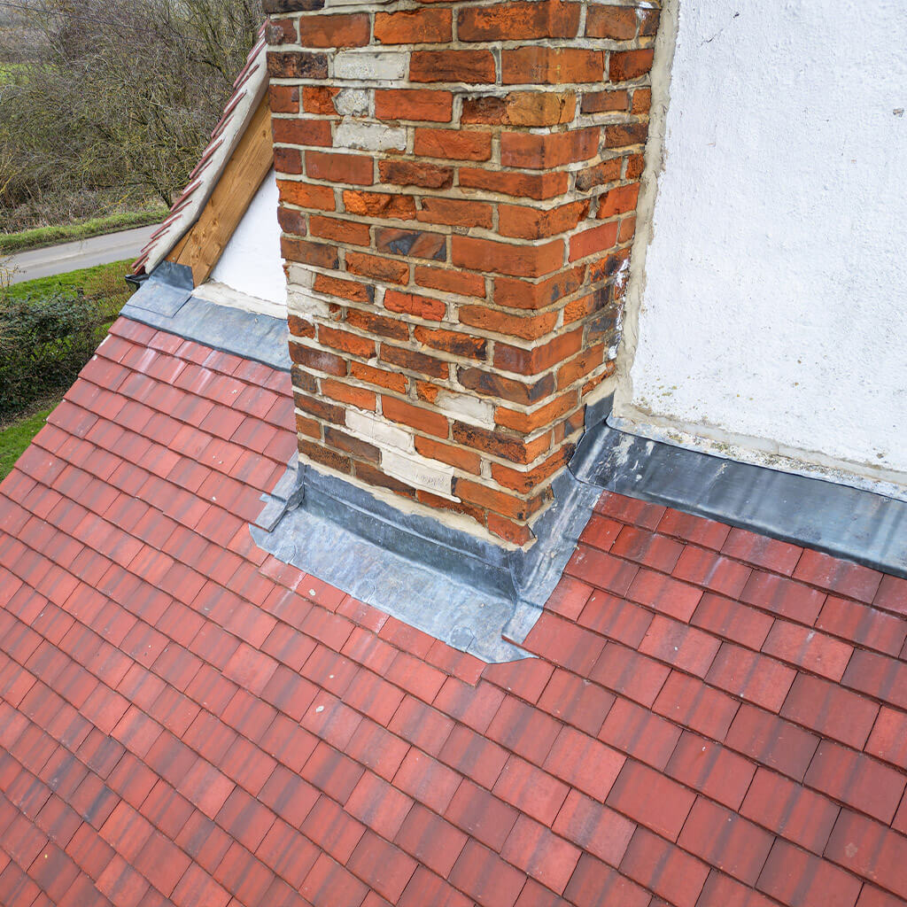Lead flashing repairs around a chimney stack